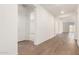 Inviting entryway with hardwood floors, white walls, and ample natural light at 25221 N 131St Dr, Peoria, AZ 85383