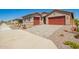 Beautiful single-Gathering home with a two-car garage and a well-maintained front yard and a driveway at 25221 N 131St Dr, Peoria, AZ 85383