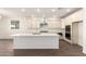Contemporary kitchen featuring an island, stainless steel appliances, and ample storage space at 25221 N 131St Dr, Peoria, AZ 85383