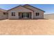 Spacious backyard featuring a covered patio, awaiting personalized landscaping touches at 25319 N 131St Dr, Peoria, AZ 85383