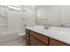 Modern bathroom featuring a shower and bathtub combo and vanity at 25319 N 131St Dr, Peoria, AZ 85383
