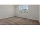 Bright bedroom with natural light from window and carpeted floor at 25319 N 131St Dr, Peoria, AZ 85383
