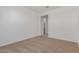 Bright bedroom featuring neutral carpeting and an ensuite bathroom at 25319 N 131St Dr, Peoria, AZ 85383