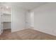 Carpeted bedroom featuring white walls and open doors at 25319 N 131St Dr, Peoria, AZ 85383