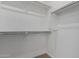 Walk-in closet with ample shelving for storage at 25319 N 131St Dr, Peoria, AZ 85383