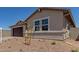 Charming single-story home featuring a two-car garage and low maintenance desert landscaping at 25319 N 131St Dr, Peoria, AZ 85383