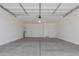 Spacious two-car garage with painted walls and concrete floors, ready for parking and storage at 25319 N 131St Dr, Peoria, AZ 85383
