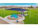 Community playground area featuring a shaded play structure with climbing wall and water fountain at 25319 N 131St Dr, Peoria, AZ 85383