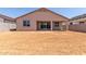 Unlandscaped backyard offering ample space to create a beautiful outdoor living area at 25324 N 131St Dr, Peoria, AZ 85383