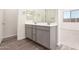 Modern bathroom featuring double sinks and vanity with tile floors at 25324 N 131St Dr, Peoria, AZ 85383