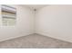 Cozy bedroom showcasing natural lighting and neutral walls at 25324 N 131St Dr, Peoria, AZ 85383