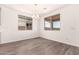 Dining room features modern lighting and two large windows at 25324 N 131St Dr, Peoria, AZ 85383