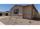 Exterior view of a home with neutral-toned siding, and landscaping, set against a clear blue sky at 25324 N 131St Dr, Peoria, AZ 85383