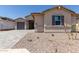 Charming single-story home featuring a paved driveway, neutral-toned exterior, and meticulously landscaped front yard at 25324 N 131St Dr, Peoria, AZ 85383