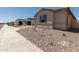 View of a new build home exterior with desert landscaping on a sunny day at 25324 N 131St Dr, Peoria, AZ 85383