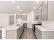 Modern kitchen featuring stainless appliances, island, and ample counter space at 25324 N 131St Dr, Peoria, AZ 85383