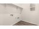 Laundry room with wood-style flooring, shelf, a window for natural light, and hookups for the machines at 25324 N 131St Dr, Peoria, AZ 85383