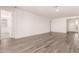 Bright living room featuring hardwood floors and neutral walls at 25324 N 131St Dr, Peoria, AZ 85383