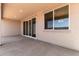 Covered patio featuring a concrete floor and sliding glass doors for seamless indoor/outdoor living at 25324 N 131St Dr, Peoria, AZ 85383