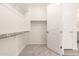 Walk-in closet with new carpet and ample storage space at 25324 N 131St Dr, Peoria, AZ 85383