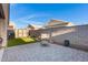 Relaxing backyard featuring a patio, artificial grass, and an outdoor storage shed at 2629 E Hidalgo Ave, Phoenix, AZ 85040