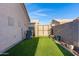 Backyard artificial turf area with an outdoor storage shed at 2629 E Hidalgo Ave, Phoenix, AZ 85040