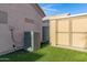 Backyard with artificial turf and storage shed at 2629 E Hidalgo Ave, Phoenix, AZ 85040