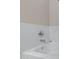 Detail of a bathtub featuring a chrome faucet and pristine white tiling at 2629 E Hidalgo Ave, Phoenix, AZ 85040
