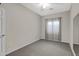 Neutral bedroom with carpet flooring features a window for natural light at 2629 E Hidalgo Ave, Phoenix, AZ 85040