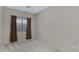 Neutral bedroom with carpet flooring features a window for natural light at 2629 E Hidalgo Ave, Phoenix, AZ 85040