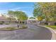 Community entrance with gate and professionaly landscaped at 2629 E Hidalgo Ave, Phoenix, AZ 85040