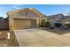 A single-story home with a two-car garage and desert landscaping visible at 2629 E Hidalgo Ave, Phoenix, AZ 85040