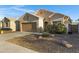 Single-story home showcasing a two-car garage and low-maintenance desert landscaping at 2629 E Hidalgo Ave, Phoenix, AZ 85040