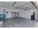 A well-organized garage with storage shelves, water softener, and ample space at 2629 E Hidalgo Ave, Phoenix, AZ 85040