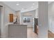 Bright kitchen featuring wood cabinets, stainless steel appliances, and an open view to the living room at 2629 E Hidalgo Ave, Phoenix, AZ 85040