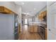 Bright kitchen features stainless steel refrigerator and appliances, and an open layout at 2629 E Hidalgo Ave, Phoenix, AZ 85040