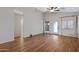 Open living room with wood-look floors and a view of the entrance and patio doors at 2629 E Hidalgo Ave, Phoenix, AZ 85040