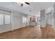 Bright and airy living room with wood-look flooring and an open layout, leading to the kitchen at 2629 E Hidalgo Ave, Phoenix, AZ 85040