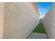 Side yard with walkway and strip of artifical turf at 2629 E Hidalgo Ave, Phoenix, AZ 85040