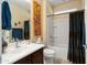 Bathroom with vanity, bathtub, and blue decorative elements at 26456 W Cat Balue Dr, Buckeye, AZ 85396