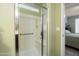 Walk in shower with built in seat, grab bar and sliding glass door at 26456 W Cat Balue Dr, Buckeye, AZ 85396