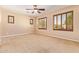 Spacious bedroom with neutral carpet and plantation shutters at 29703 N 70Th Ave, Peoria, AZ 85383
