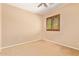 Neutral bedroom with ceiling fan, window offering natural light and ample space at 29703 N 70Th Ave, Peoria, AZ 85383