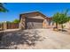 Single-story house with stucco and stone exterior, desert landscaping, and a spacious driveway at 29703 N 70Th Ave, Peoria, AZ 85383