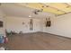 Spacious garage with ample storage space and high ceilings can be used for multiple purposes at 29703 N 70Th Ave, Peoria, AZ 85383