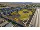 Aerial view of a community green space with meandering pathways, grassy areas, and mature trees at 3661 E Appaloosa Dr, San Tan Valley, AZ 85140
