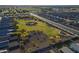 A sprawling community park aerial featuring walkways, open grass areas, desert landscaping, and inviting shade trees at 3661 E Appaloosa Dr, San Tan Valley, AZ 85140