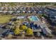 Aerial view of community recreation center with pool, playground, and clubhouse nestled in a neighborhood at 3661 E Appaloosa Dr, San Tan Valley, AZ 85140