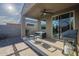 Covered back patio with pavers, a ceiling fan, seating, and a BBQ grill at 3661 E Appaloosa Dr, San Tan Valley, AZ 85140
