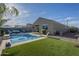 Backyard with a pool, lounge chairs, desert landscaping, and space to relax at 3661 E Appaloosa Dr, San Tan Valley, AZ 85140